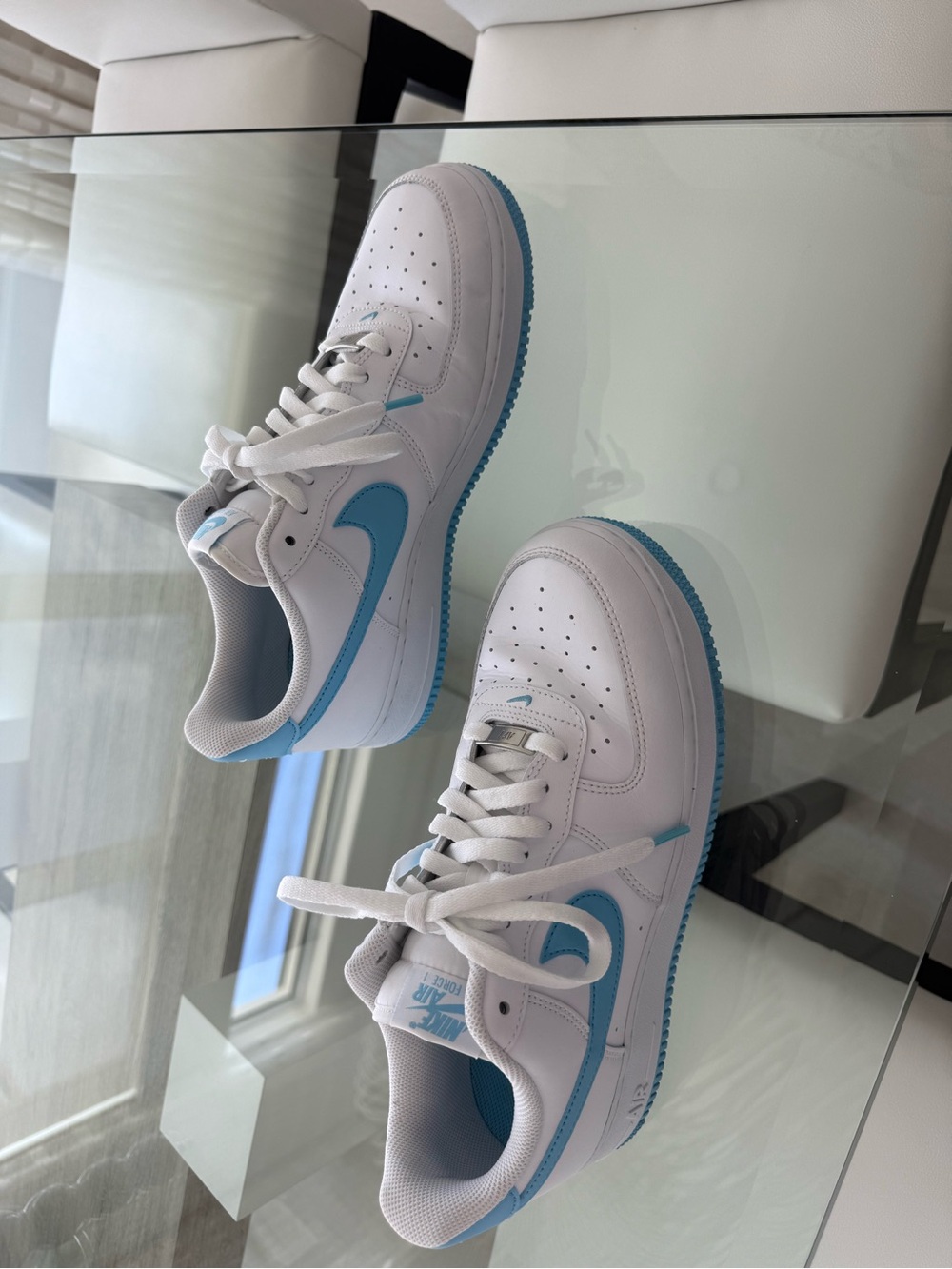Nike White Low-Top Sneakers with Light Blue Swoosh